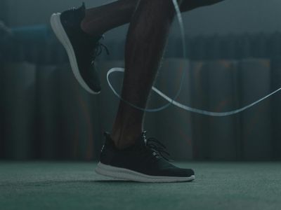 Blurred motion of a person jumping during cardio training