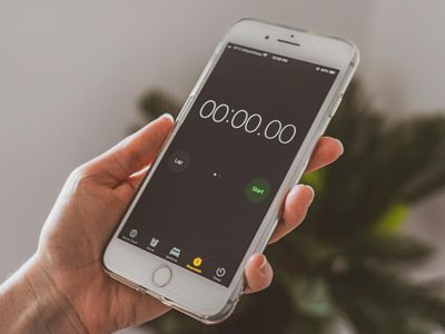 Close up of hands holding a stopwatch or timer