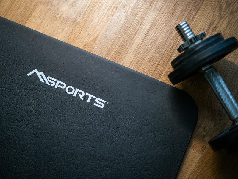 High angle view of fitness equipment on wooden floor